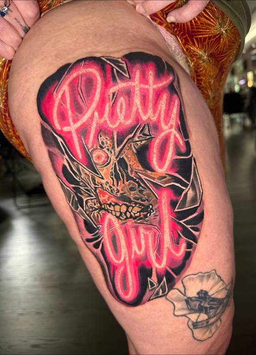 Neon pink Terrifier Pretty Girl tattoo by Justin Styndl