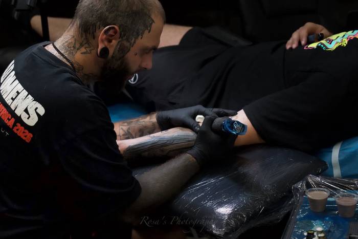 Justin Styndl tattooing a client at Cardinal Ink