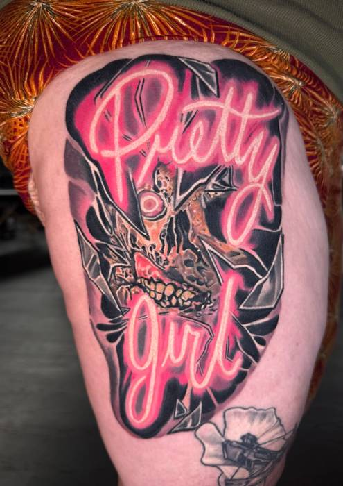 Neon pink Terrifier-inspired Pretty Girl tattoo by Justin Styndl