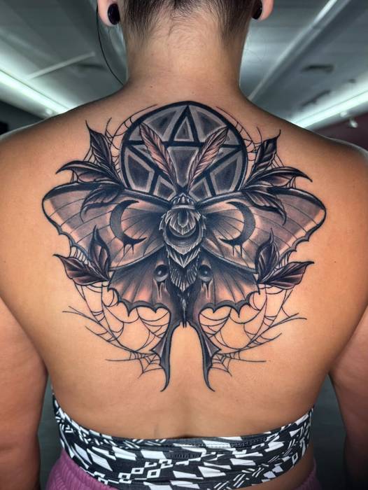Black-and-gray luna moth back tattoo by Justin Styndl
