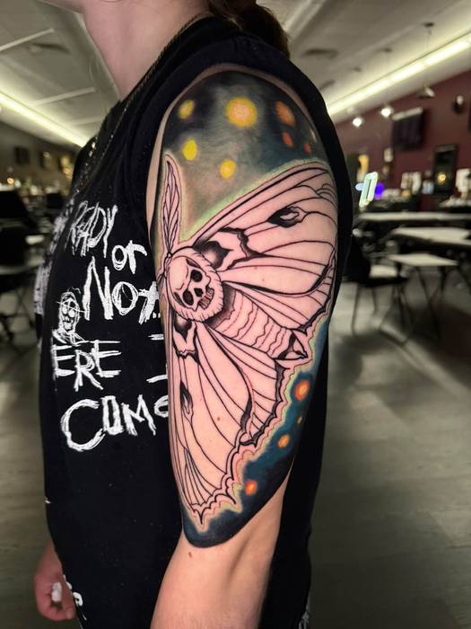 Color luna moth tattoo with a night-sky wing by Justin Styndl