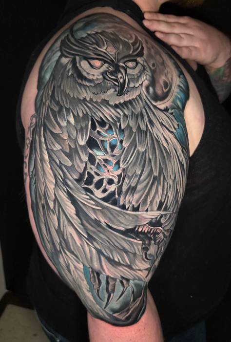 Large black-and-gray owl cover-up tattoo by Justin Styndl