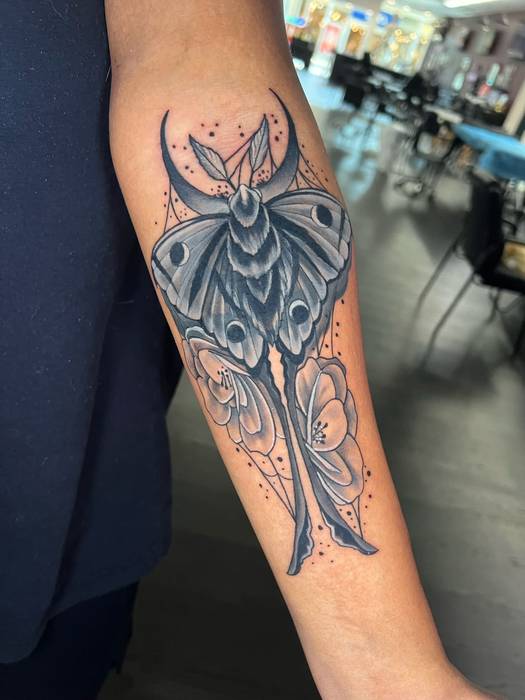 Black-and-gray luna moth cover-up tattoo by Justin Styndl